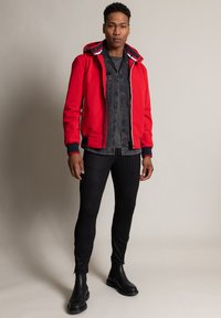 Wellensteyn Regenjacke / wasserabweisende Jacke - rot