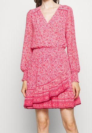Pink floral dress with long sleeves, V-neckline, and gathered waist. Features ruffled hem and horizontal bands with intricate patterns.