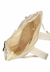 Sac fourre-tout beige avec un extérieur lisse, fermeture éclair et poches intérieures. Doublé d'un tissu léger, avec une bandoulière.