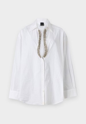 Camicia bianca in cotone con bottoni, caratterizzata da un collo a V con decorazioni in argento, maniche lunghe e una vestibilità rilassata.