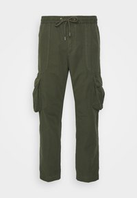 Cargo-Hosen aus olivgrünem Baumwollmix. Mit elastischem Bund und Kordelzug, seitlichen Taschen und zwei großen Cargo-Taschen an den Beinen.