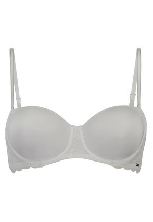 Witte beha met een glad ribbelstof, gewatteerde cups en kantafwerking langs de band. Verstelbare schouderbanden met een haak-en-oogsluiting.