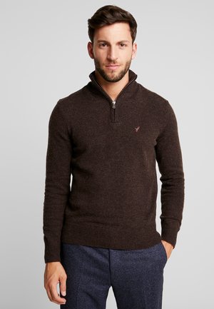 Dark brown zip-neck pullover sweater made of soft fabric, featuring ribbed cuffs and hem, and a small logo accent on the chest.