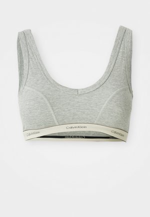 Grijze katoenen bralette met een ronde hals, brede bandjes en een zachte beige band met het zwarte "Calvin Klein" logo.