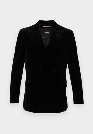 Zwarte dubbelzijdige fluwelen blazer met pieklapels, knoopmanchetten en twee voorste klepzakken, gelabeld met "BOSS" aan de binnenkant van de kraag.