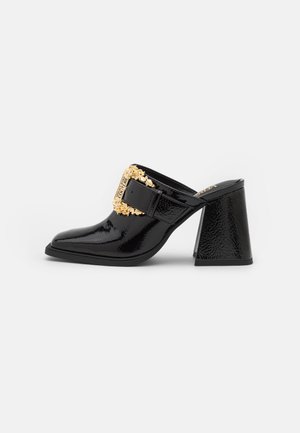 Heeled mules - black