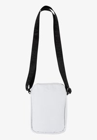 White crossbody bag with a rectangular shape, featuring a textured surface, black adjustable strap with branding, and a fastening buckle.