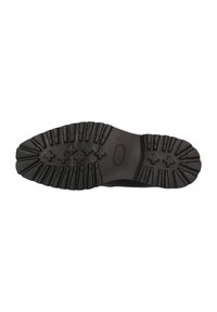 Suela de zapato de goma negra con un patrón de banda de rodadura texturizado que incluye agarres y ranuras elevadas para mejorar la tracción. Diseño de tacón plano con puntera redondeada.