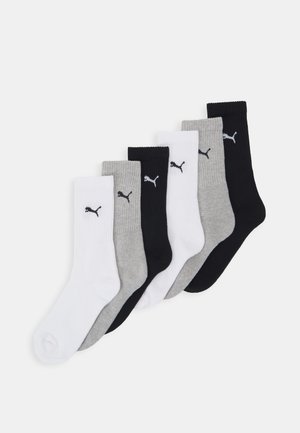 Sechs Paar Kniestrümpfe in Schwarz, Weiß und Grau, mit gerippten Bündchen und kleinen Logoakzenten. Aus weichem Baumwollmischgewebe.