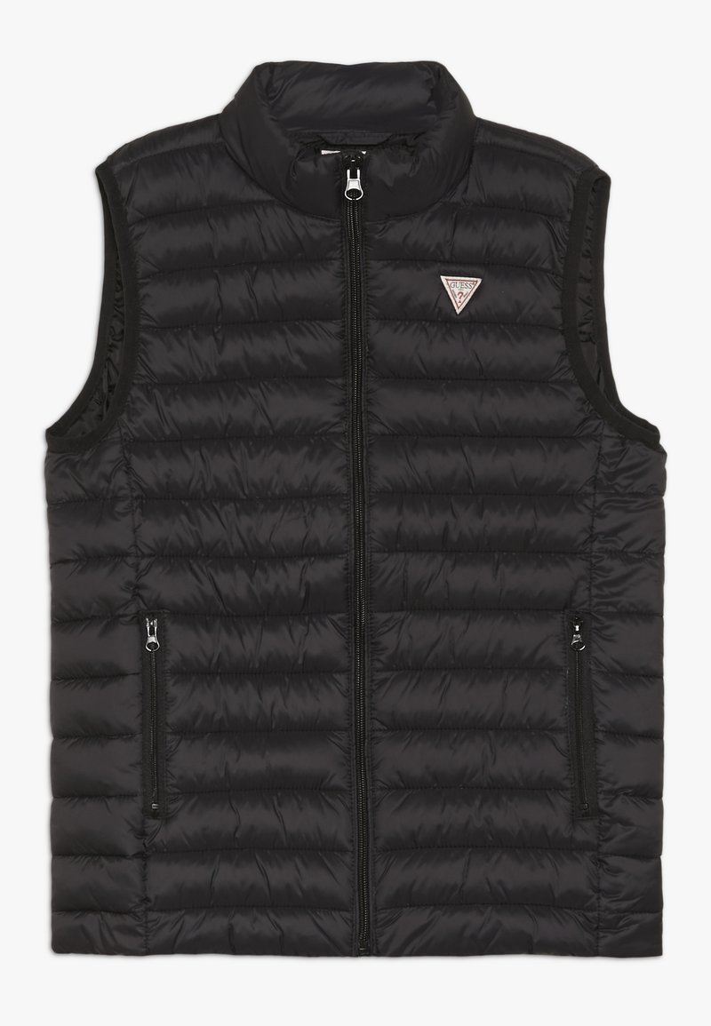 Veste matelassée noire en matériau brillant, avec un col montant, une fermeture éclair à l'avant et deux poches latérales zippées. Détail logo sur la poitrine.