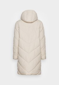 Long beige padded winter coat with hood, chevron quilting pattern, and long sleeves, shown from the back on a white background.