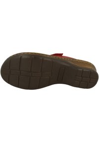 Red sandal with a textured brown outsole featuring a grid pattern, cushioned footbed, and a beige woven design along the edge.