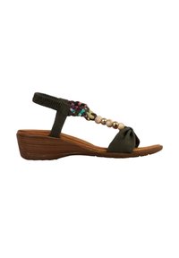 Mørkegrøn sandal med en flettet, flerfarvet rem og perle-detalje på tåen. Har en lav træ-wedge hæl og en knyttet stofdetalje.