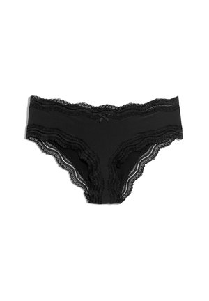 Panties de encaje negro con un cuerpo suave, que presentan un pequeño lazo de satén en la parte central delantera y bordes festoneados en la cinturilla.