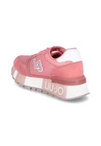Scarpe da ginnastica rosa con tomaia in rete, dettagli in suede, contrafforte bianco e suola in gomma spessa con bordi glitterati e dettagli con il logo.