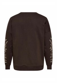 Donkerbruine sweatshirt met lange mouwen, voorzien van lichtgekleurde bladeren en rankpatronen langs de buitenkant van de armen, gezien vanaf de achterkant.