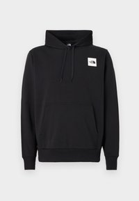 Sweat à capuche noir à enfiler avec poche kangourou à l'avant, capuche avec cordon, poignets côtelés, et petit logo blanc « The North Face » sur la poitrine gauche.