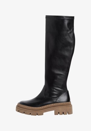 Black leather knee-high boot with a smooth texture, rounded toe, thick tan rubber sole featuring ridged detailing and a side seam.