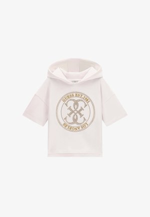 Sweat à capuche blanc à manches courtes avec logo circulaire doré Guess et texte "GUESS EST. 1981 LOS ANGELES" sur le devant.