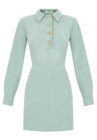 Abito verde menta con colletto, maniche lunghe e cinque bottoni decorativi sul davanti. Tessuto morbido con una silhouette aderente.