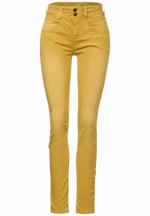 Slim-fit sennepsgule jeans med dobbelt knap og lynlås, for- og baglommer samt talje i mellem-højde.