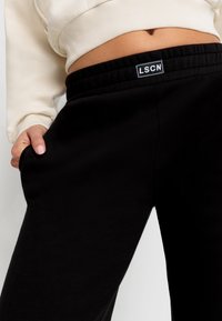 LASCANA LSCN BY LASCANA - Treniņtērpa apakšdaļas - schwarz