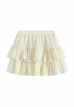 Crème-kleurige, gelaagde rok van een gestructureerde stof. Heeft drie gerimpelde lagen en een elastische tailleband voor een aanpasbare pasvorm.