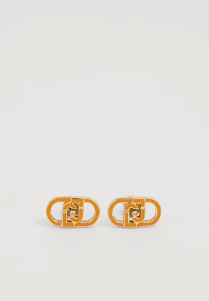 Orange enamel and silver-tone metal earrings with an interlocking geometric pattern, featuring circular accents in the center.
