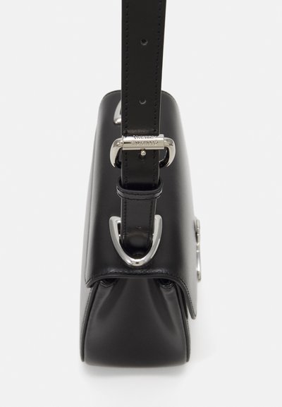 Black leather handbag with a structured design, featuring a silver-tone hardware clasp and a flat, adjustable strap. Textured surface detail.