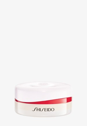 Récipient cosmétique rond blanc et rouge avec le logo Shiseido sur un fond clair uni.