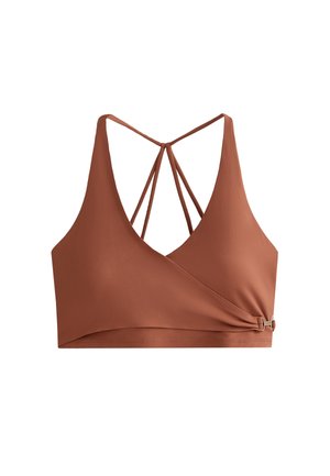 Crop top en bronze avec un décolleté en V profond, des bretelles croisées au dos et un détail de nœud sur le côté avec une touche métallique. Tissu lisse et extensible.