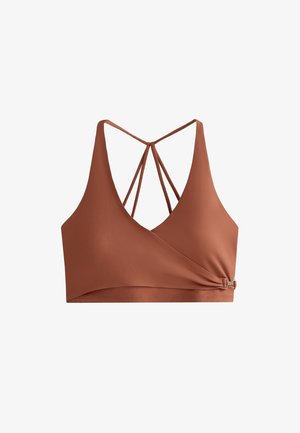 Bronz színű crop top, mély V-nyakkivágással, keresztbe futó pántokkal és oldalsó csomó részlettel, fémes kiemeléssel. Simogató, rugalmas anyag.