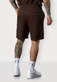 ESTEEM PLEATED - Tracksuit bottoms - coffee