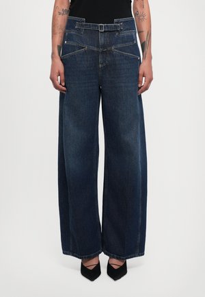 Wide-leg blue denim jeans with a high waist, featuring a belt loop, two front pockets, and contrasting stitching details.