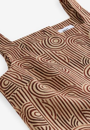 Cotton apron featuring a geometric design with brown concentric circles and lines on a beige background. Includes a front pocket.