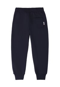 Nachtschwarze Sweatpants mit elastischem Bund, schmal zulaufendem Bein und einer einzelnen Gesäßtasche. Hergestellt aus weichem, strapazierfähigem Stoff.