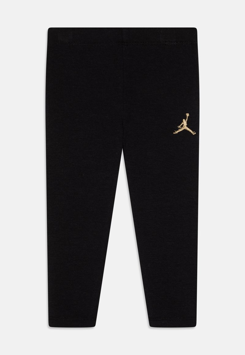 Schwarze Leggings aus dehnbarem Material. Mit einem goldenen Jordan-Logo auf der linken Seite. Einfaches Design mit einem elastischen Taillenbund.