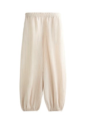 Béžové voľné nohavice s tenkými vertikálnymi pruhmi, elastickým pásom a elastickými koncami pri členkoch.