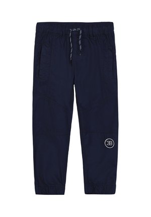 Navy blue drawstring jogger pants with elastic cuffs, side pockets, and a circular logo on the lower left leg.