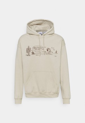 Hoodie beige avec une poche avant, présentant un motif marron d'un personnage de dessin animé, des cactus, et du texte dans un style simple et en contour.