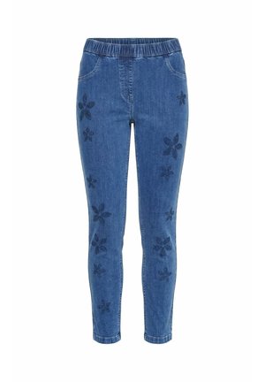 Blaue Skinny-Denimhose mit elastischem Bund und dunklen floralen Perlenverzierungen an den Vorderbeinen.