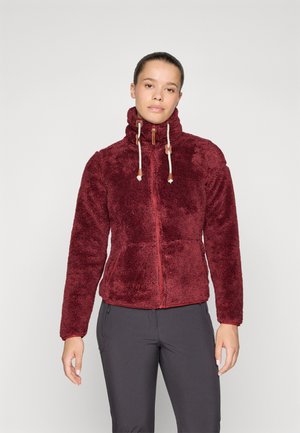 Bordeaux fleece jack met hoge kraag, volledige rits en trekkoorden. Zachte textuur met een licht glanzende afwerking. Beschikt over twee zijzakken.