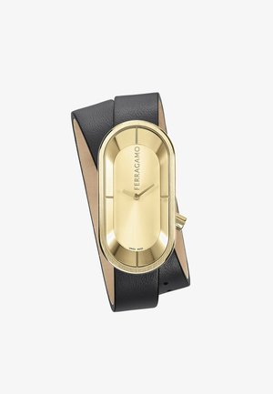 Reloj ovalado dorado con una correa de cuero negro texturizado y un fondo de cuero suave. Presenta manecillas de hora y minuto y la marca 'Ferragamo'.