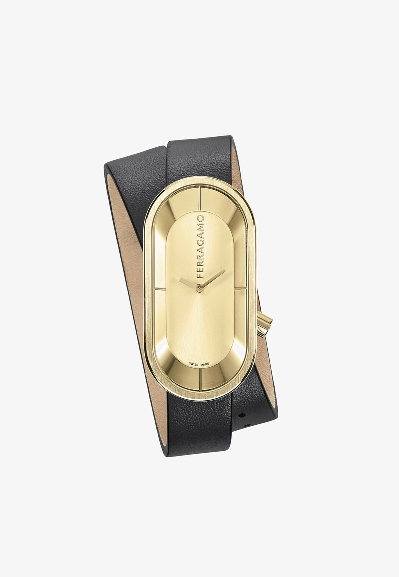 Gouden ovale horloge met een gestructureerde zwarte leren band en een gladde leren onderzijde. Bevat uur- en minutenwijzers en 'Ferragamo' branding.