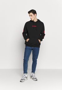 YOURTURN - UNISEX - Hoodie - black Thumbnail Image 1