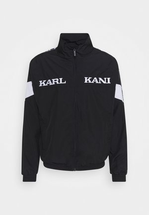 Karl Kani Kevyt takki - black