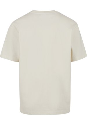 Maglietta beige semplice a maniche corte vista da dietro con scollo rotondo e vestibilità morbida.