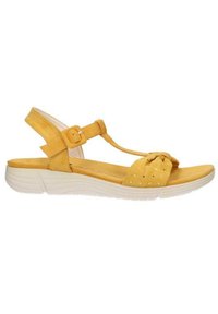 Sandal in camoscio giallo con design a T-strap, dettaglio annodato sulla punta e suola in gomma bianca. Cinghietta regolabile alla caviglia con fibbia.