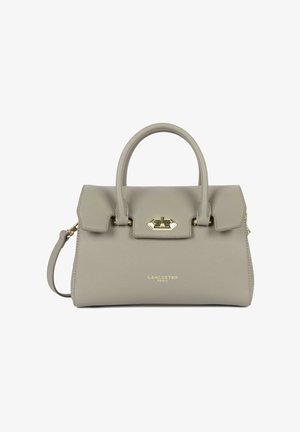 Sac à main en cuir beige avec poignée supérieure, fermeture à boucle dorée, et bandoulière amovible, de la marque "Lancaster Paris".