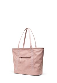 Rosa Tragetasche aus strapazierfähigem Stoff, mit zwei langen Griffen, einer Vordertasche und geprägtem Logo-Detail auf der Vorderseite.